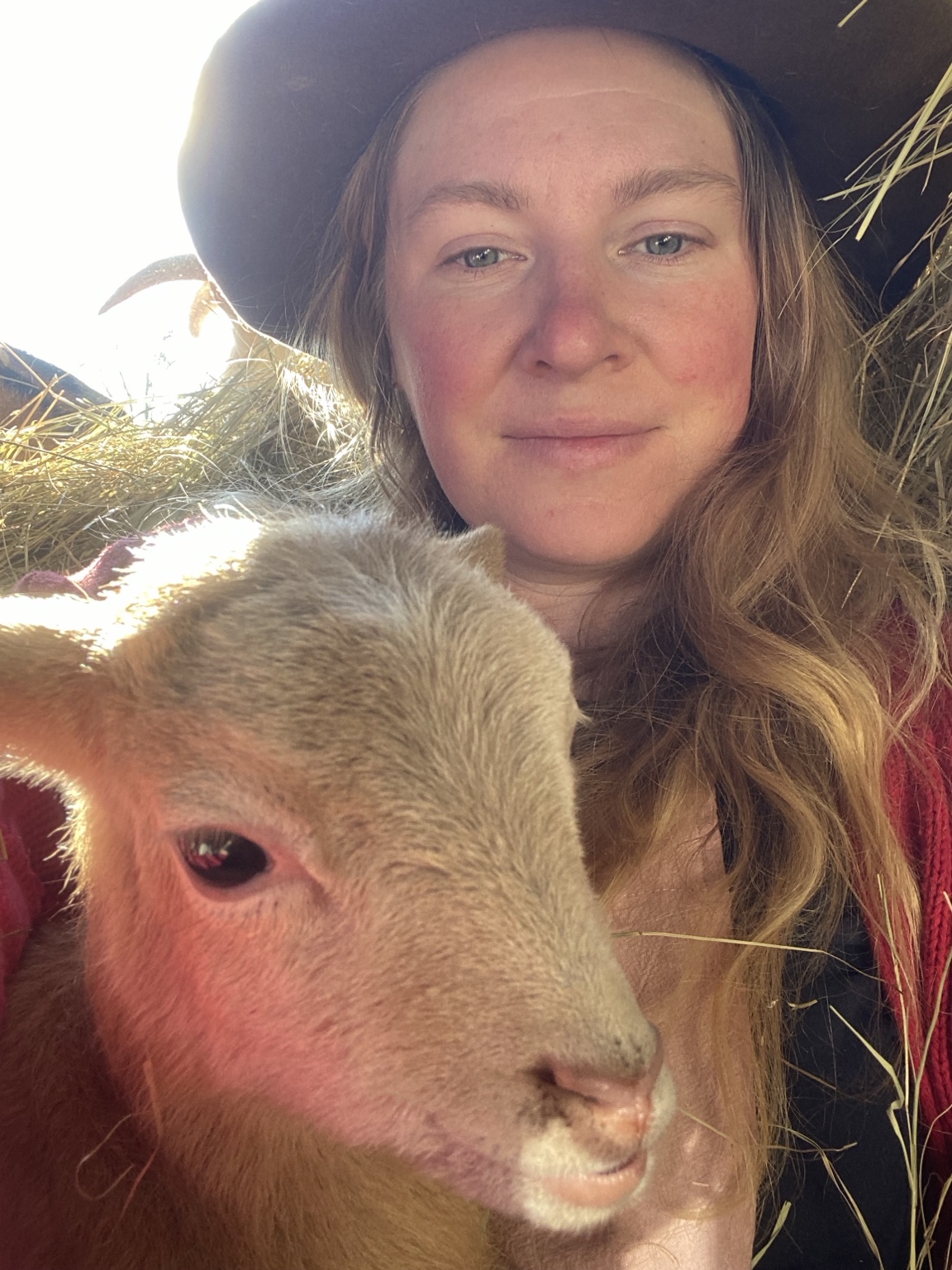 Allyssa Ferguson with a lamb on her South Carolina farm